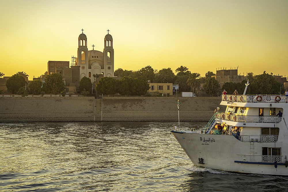 View of cruise boats from cruise boat near Esna on the Nile River at sunset, Esna, Egypt, Africa