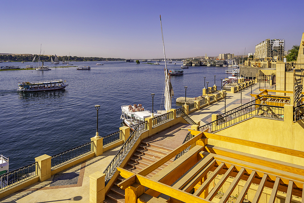 View of boats on the Nile river from promenade on a sunny day, Aswan, Nubia, Egypt, North Africa, Africa