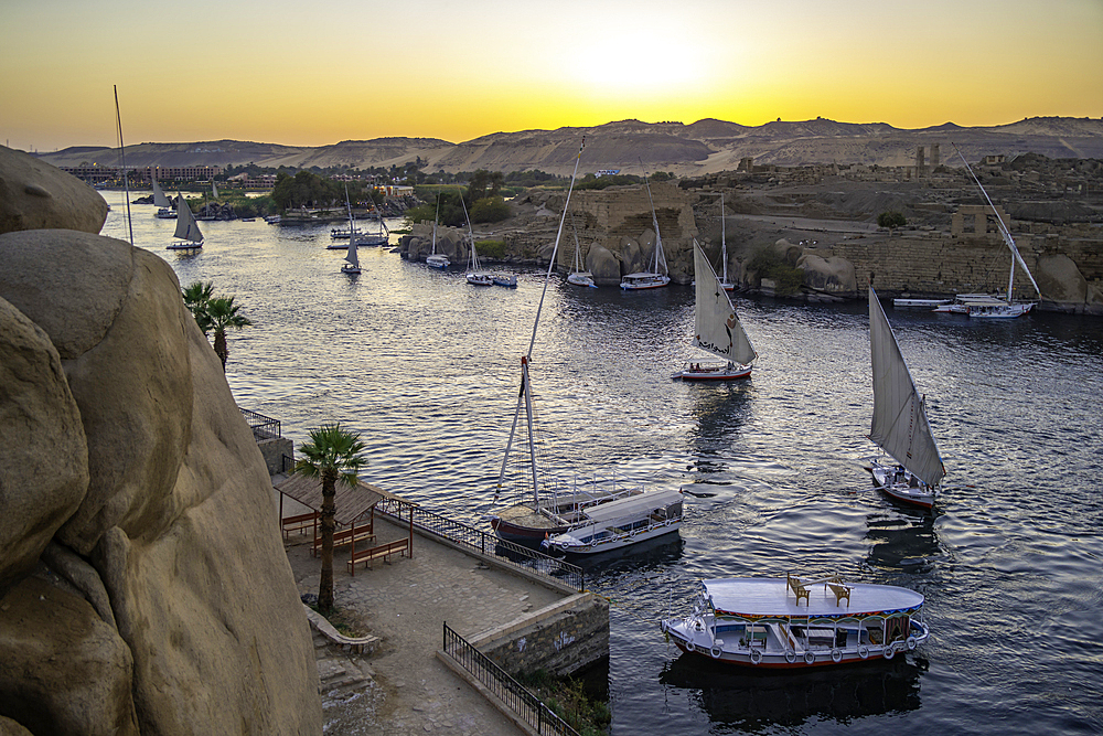 View of fellucas on the Nile river from Feryal Garden at dusk, Aswan, Nubia, Egypt, North Africa, Africa