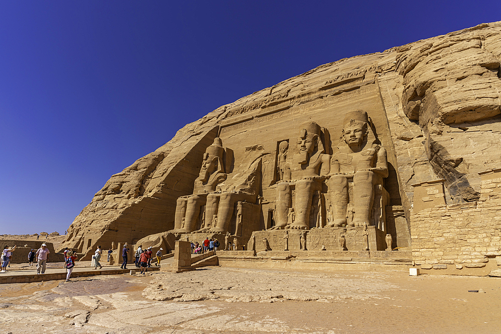 Exterior view of tourists and massive sculptures at the Abu Simbel Temple next to Lake Nasser, Temple of the Pharaohs, Ramses II, Nubia, Egypt, Africa