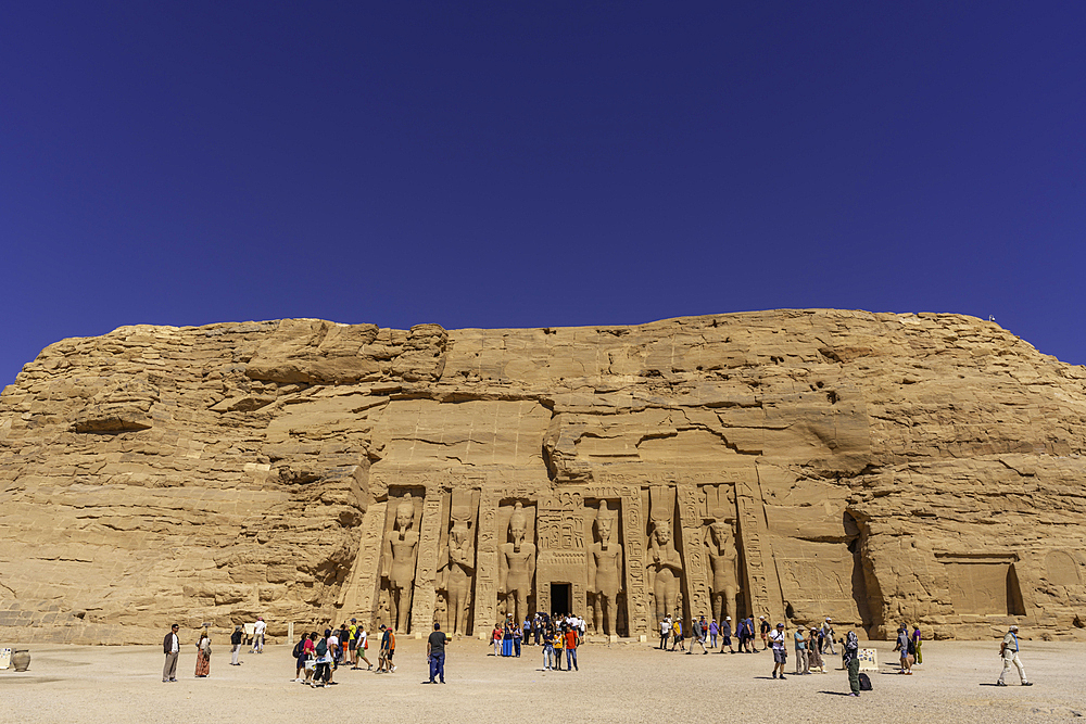 Exterior view of tourists and massive sculptures at the Temple of Hathor, Abu Simbel Temple next to Lake Nasser, Temple of the Pharaohs, Ramses II, Nubia, Egypt, Africa