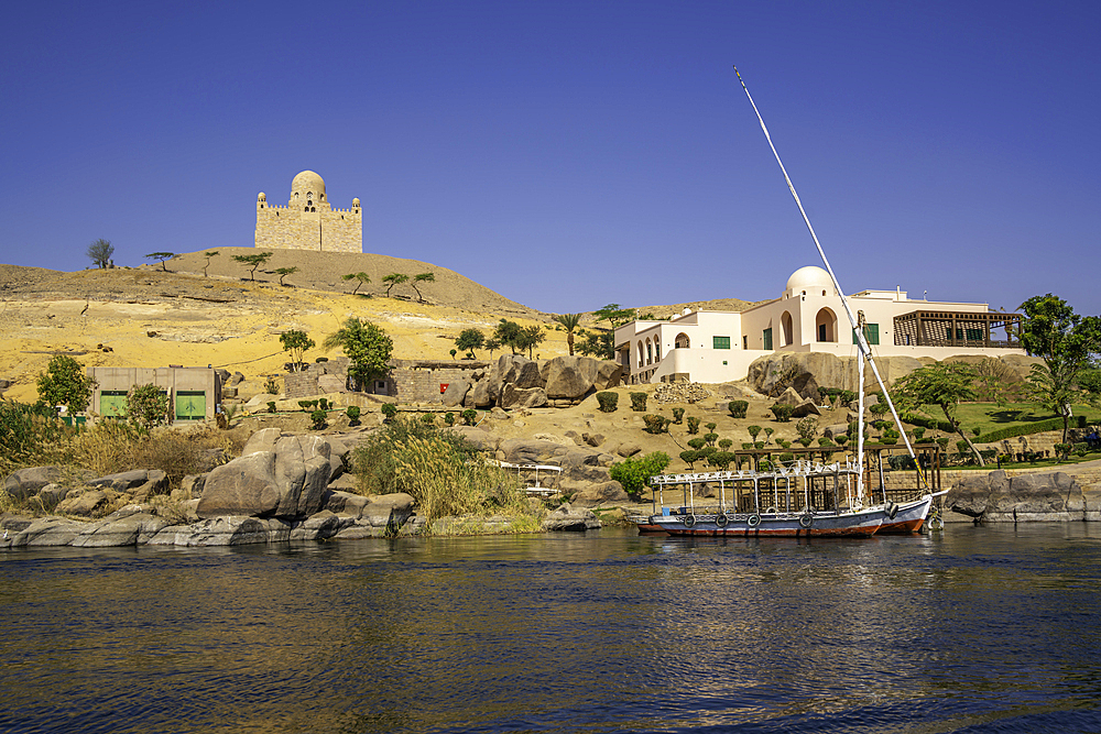 View of the Nile river and Aga Khan Mausoleum from small boat in Aswan, Aswan, Nubia, Egypt, North Africa, Africa