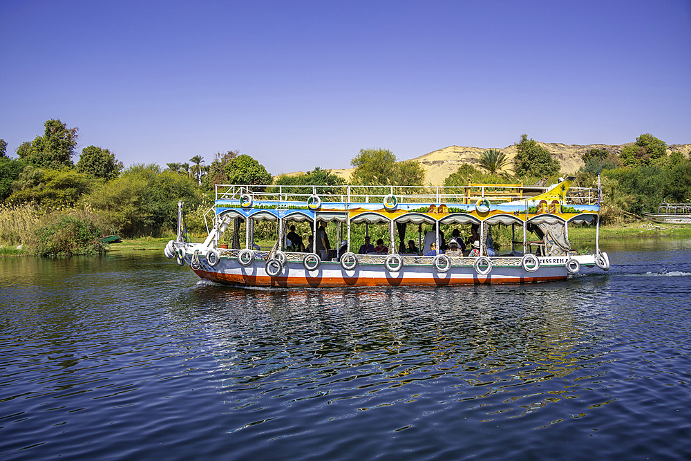 View of small boat on the Nile river from small boat in Aswan, Aswan, Nubia, Egypt, North Africa, Africa