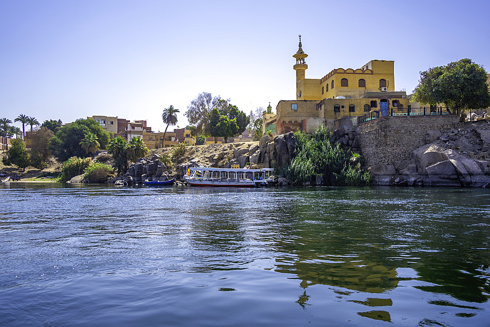 View of architecture on the Nile river from small boat in Aswan, Aswan, Nubia, Egypt, North Africa, Africa