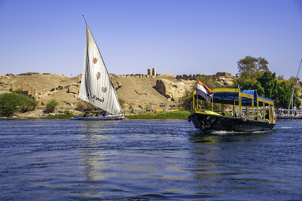 View of felucca and small boat on the Nile river from small boat in Aswan, Aswan, Nubia, Egypt, North Africa, Africa