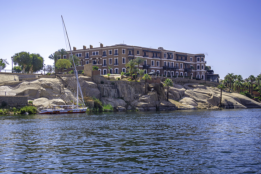 View of Old Cataract Aswan on the Nile river from small boat in Aswan, Aswan, Nubia, Egypt, North Africa, Africa