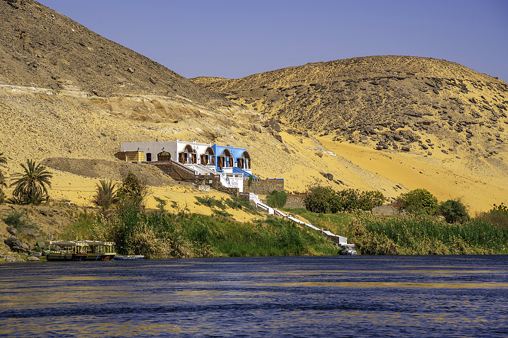 View of architecture on the Nile river from small boat in Aswan, Aswan, Nubia, Egypt, North Africa, Africa