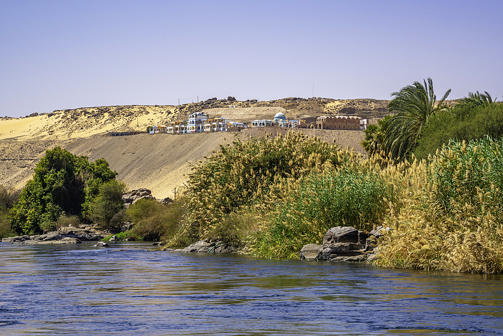 View of architecture on the Nile river from small boat in Aswan, Aswan, Nubia, Egypt, North Africa, Africa