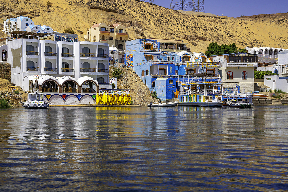 View of colourful architecture at Nagaa Suhayl Gharb on the Nile river near Aswan, Aswan, Nubia, Egypt, North Africa, Africa