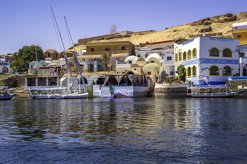 View of colourful architecture at Nagaa Suhayl Gharb on the Nile river near Aswan, Aswan, Nubia, Egypt, North Africa, Africa
