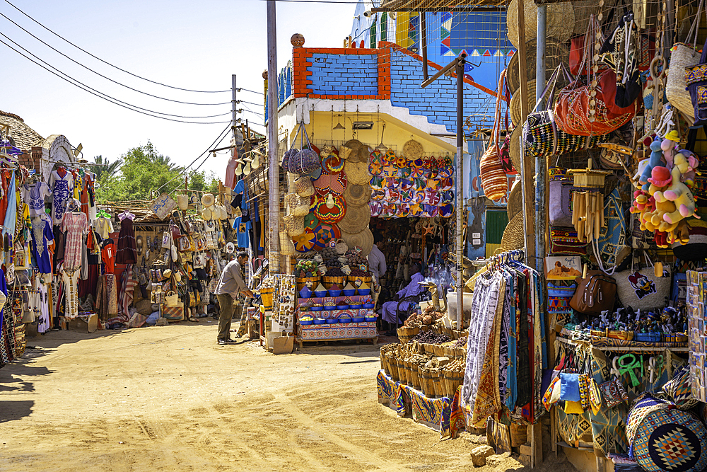 View of colourful architecture at Nagaa Suhayl Gharb on the Nile river near Aswan, Aswan, Nubia, Egypt, North Africa, Africa