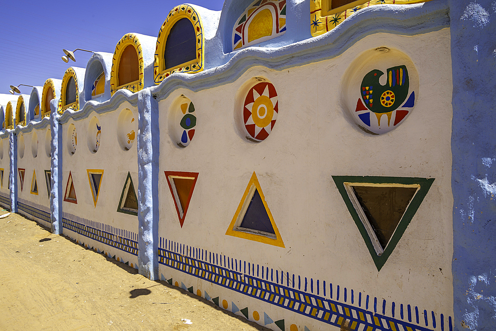 View of colourful architecture at Nagaa Suhayl Gharb on the Nile river near Aswan, Aswan, Nubia, Egypt, North Africa, Africa