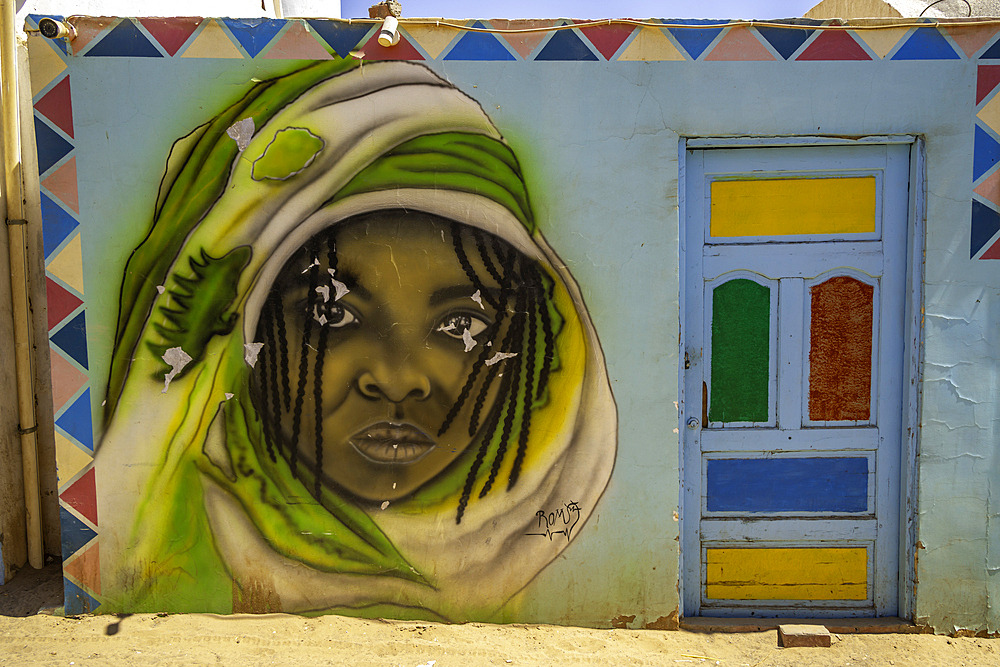 View of colourful architecture at Nagaa Suhayl Gharb on the Nile river near Aswan, Aswan, Nubia, Egypt, North Africa, Africa
