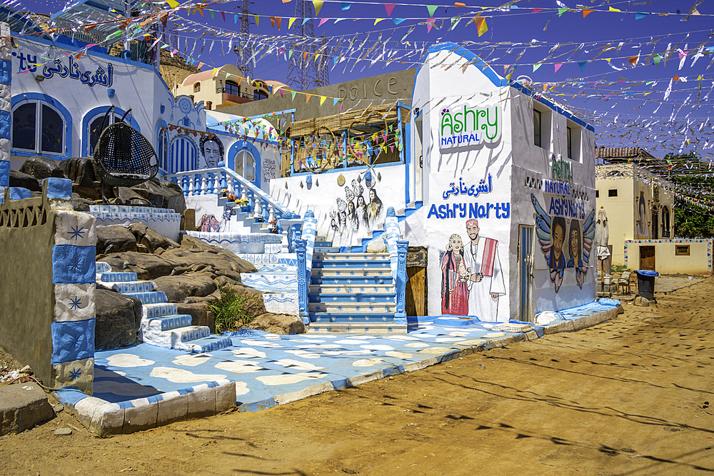 View of colourful architecture at Nagaa Suhayl Gharb on the Nile river near Aswan, Aswan, Nubia, Egypt, North Africa, Africa