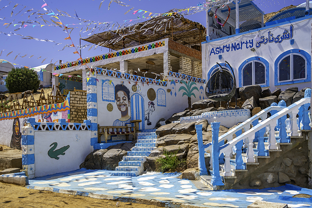 View of colourful architecture at Nagaa Suhayl Gharb on the Nile river near Aswan, Aswan, Nubia, Egypt, North Africa, Africa