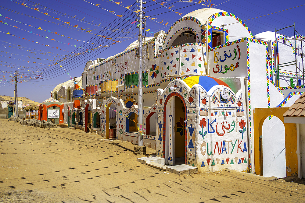 View of colourful architecture at Nagaa Suhayl Gharb on the Nile river near Aswan, Aswan, Nubia, Egypt, North Africa, Africa