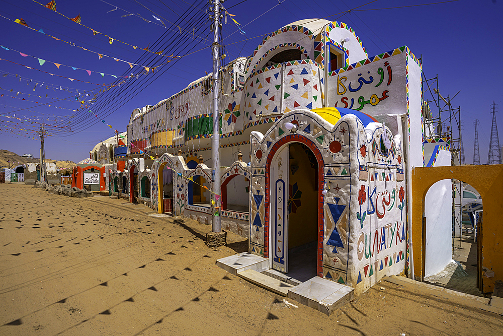 View of colourful architecture at Nagaa Suhayl Gharb on the Nile river near Aswan, Aswan, Nubia, Egypt, North Africa, Africa