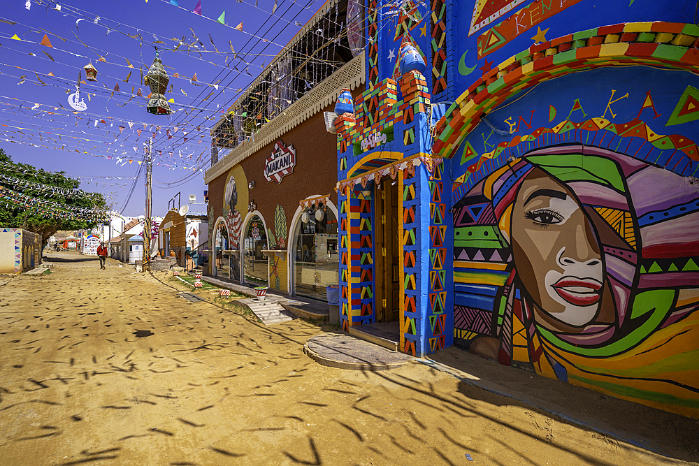 View of colourful architecture at Nagaa Suhayl Gharb on the Nile river near Aswan, Aswan, Nubia, Egypt, North Africa, Africa