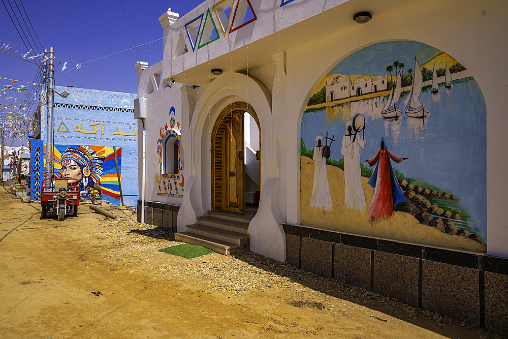 View of colourful architecture at Nagaa Suhayl Gharb on the Nile river near Aswan, Aswan, Nubia, Egypt, North Africa, Africa