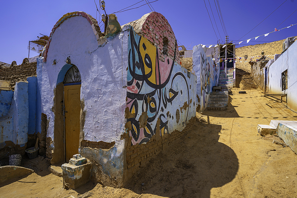 View of colourful architecture at Nagaa Suhayl Gharb on the Nile river near Aswan, Aswan, Nubia, Egypt, North Africa, Africa
