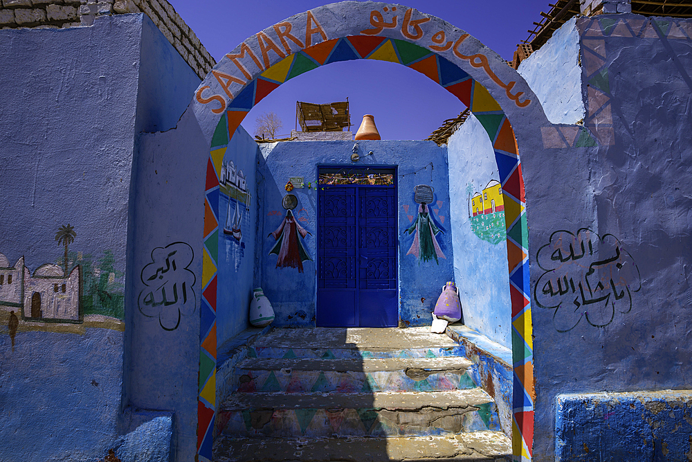 View of colourful architecture at Nagaa Suhayl Gharb on the Nile river near Aswan, Aswan, Nubia, Egypt, North Africa, Africa