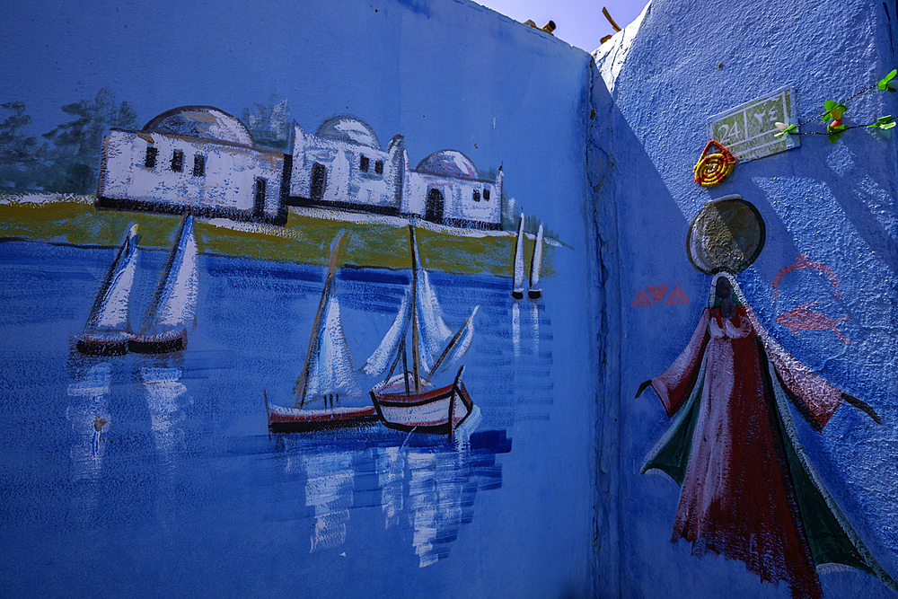 View of colourful architecture at Nagaa Suhayl Gharb on the Nile river near Aswan, Aswan, Nubia, Egypt, North Africa, Africa