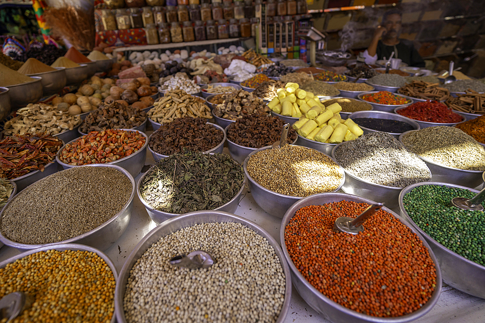 View of colourful spices on market stalls at Nagaa Suhayl Gharb on the Nile river near Aswan, Aswan, Nubia, Egypt, North Africa, Africa