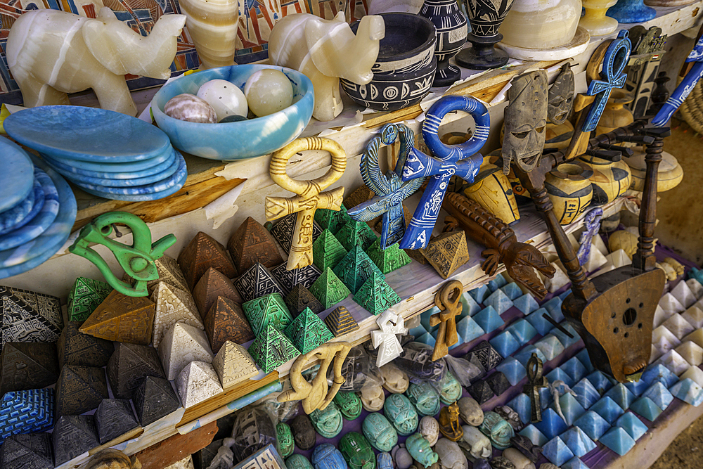 View of colourful souvenirs on market stalls at Nagaa Suhayl Gharb on the Nile river near Aswan, Aswan, Nubia, Egypt, North Africa, Africa