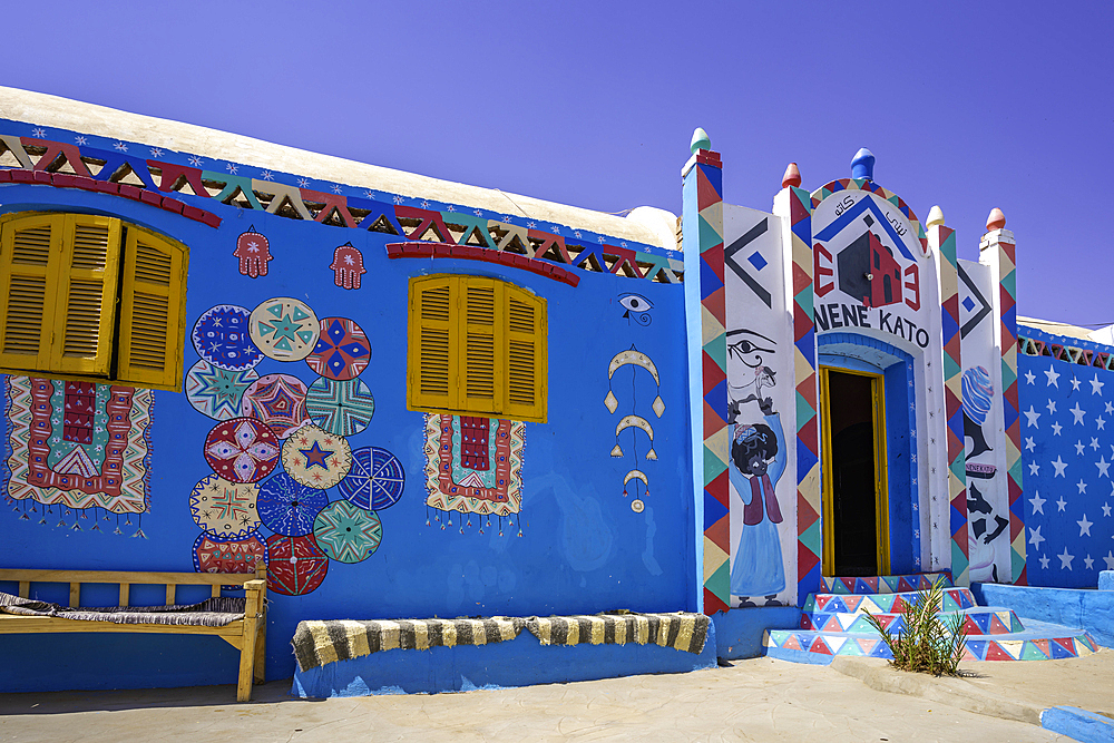 View of colourful architecture at Nagaa Suhayl Gharb on the Nile river near Aswan, Aswan, Nubia, Egypt, North Africa, Africa
