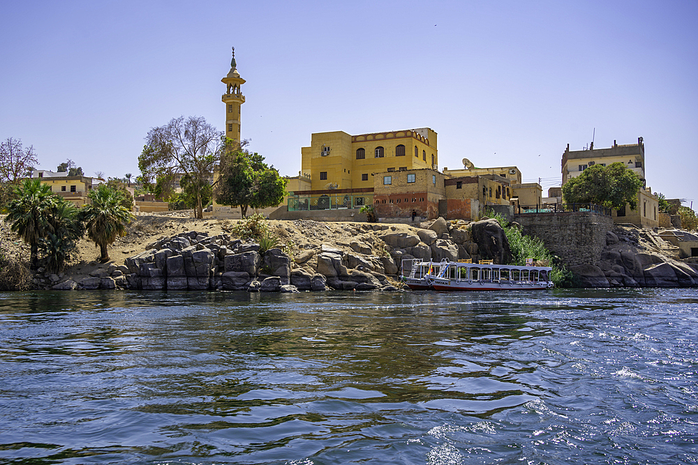 View of architecture on the Nile river from small boat in Aswan, Aswan, Nubia, Egypt, North Africa, Africa