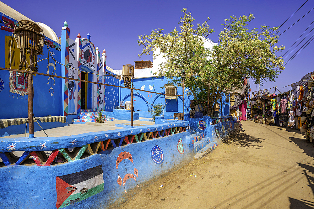 View of colourful architecture at Nagaa Suhayl Gharb on the Nile river near Aswan, Aswan, Nubia, Egypt, North Africa, Africa
