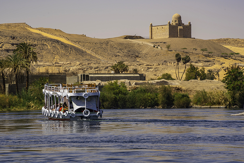 View of the Nile river and Aga Khan Mausoleum from small boat in Aswan, Aswan, Nubia, Egypt, North Africa, Africa