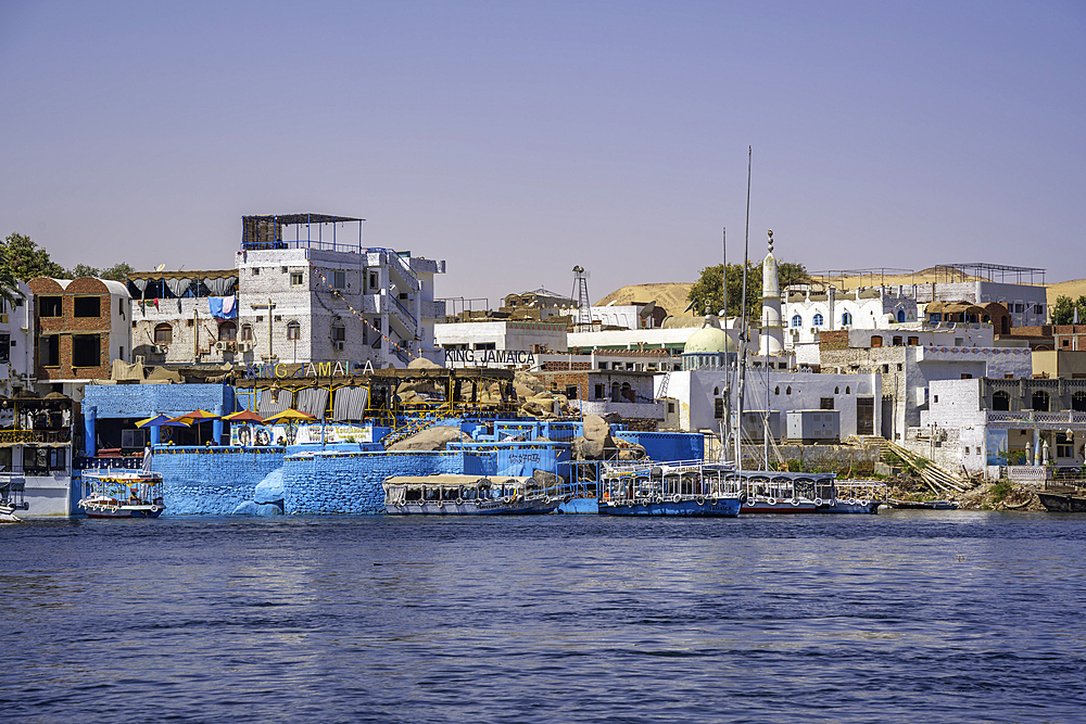 View of architecture on the Nile river from small boat in Aswan, Aswan, Nubia, Egypt, North Africa, Africa