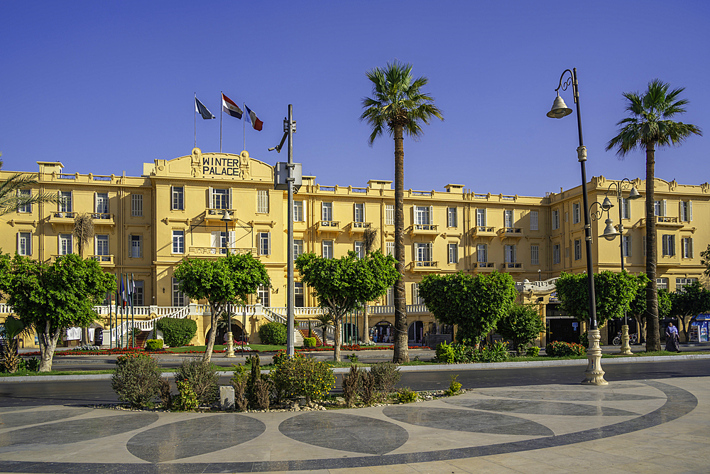 View of the Winter Palace Hotel on the corniche in Luxor on a sunny day, Luxor, Egypt, Africa