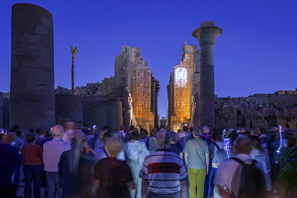 View of Karnak Temple sound and light show at dusk, Luxor, Egypt, Africa