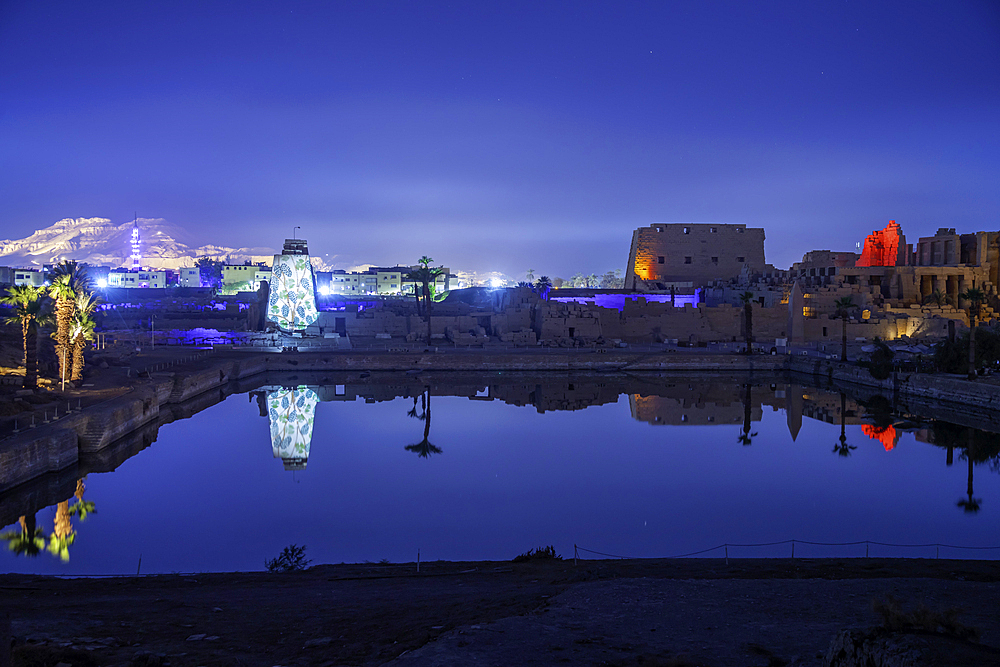 View of Karnak Temple sound and light show at dusk, Luxor, Egypt, Africa