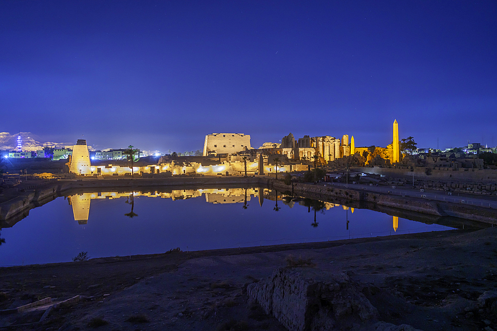 View of Karnak Temple sound and light show at dusk, Luxor, Egypt, Africa