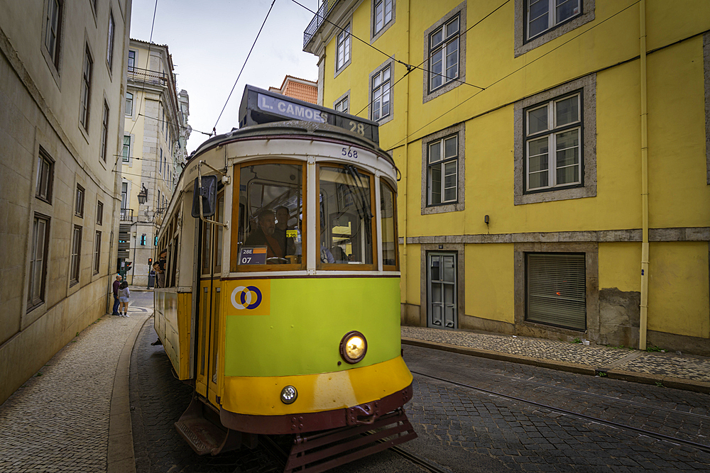 View of vintage yellow No28 tram in hystoric old town centre, Lisbon, Portugal, Europe