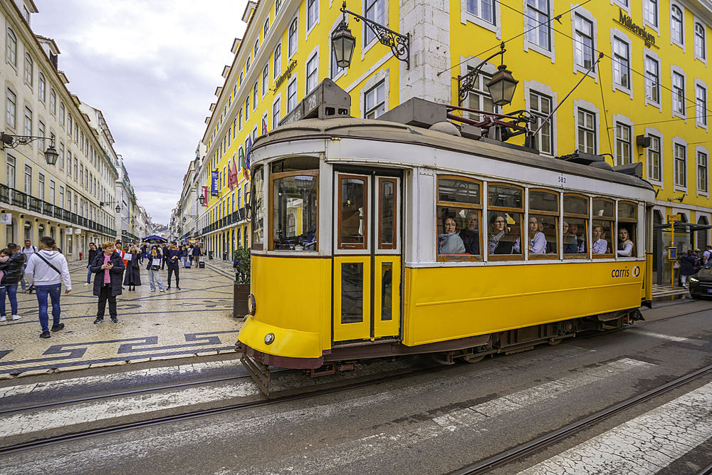 View of vintage No28 yellow tram in Lisbon city centre, Lisbon, Portugal, Europe