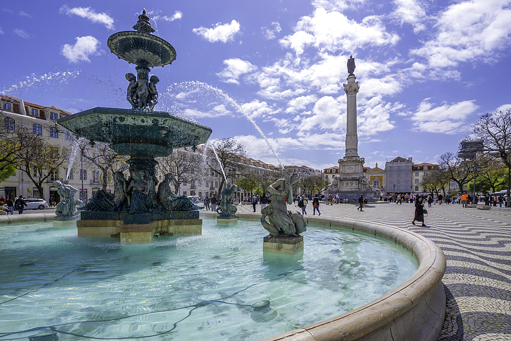 View of North fountain of Rossio in Praca do Rossio on a sunny day in Lisbon city centre, Lisbon, Portugal, Europe