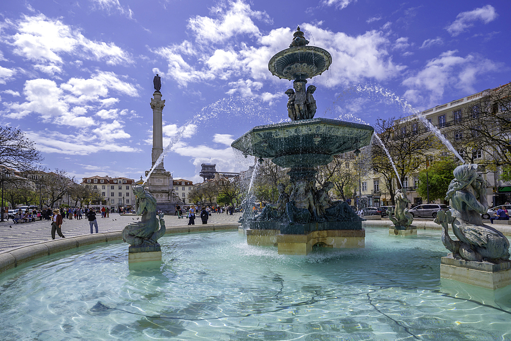 View of North fountain of Rossio in Praca do Rossio on a sunny day in Lisbon city centre, Lisbon, Portugal, Europe
