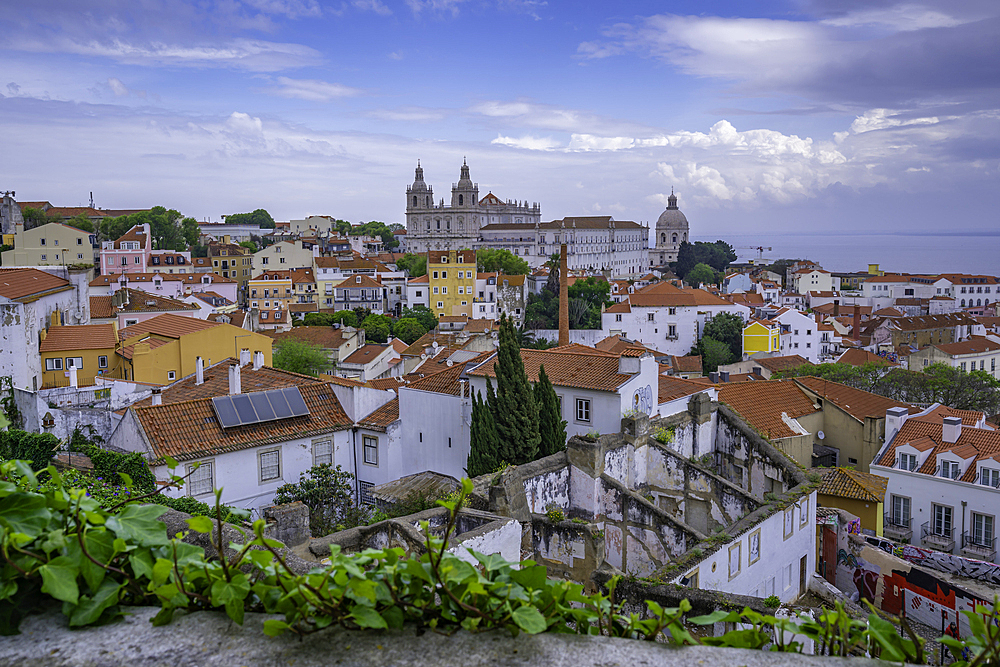 Panoramic view of rooftops and Church of St. Vincent de Fora from elevated position, Alfama District, Lisbon, Portugal, Europe