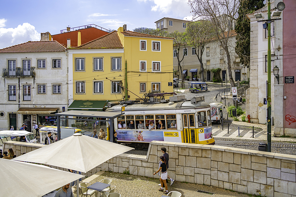 View of colourful architectecture and vintage tram in Alfama, Alfama District, Lisbon, Portugal, Europe