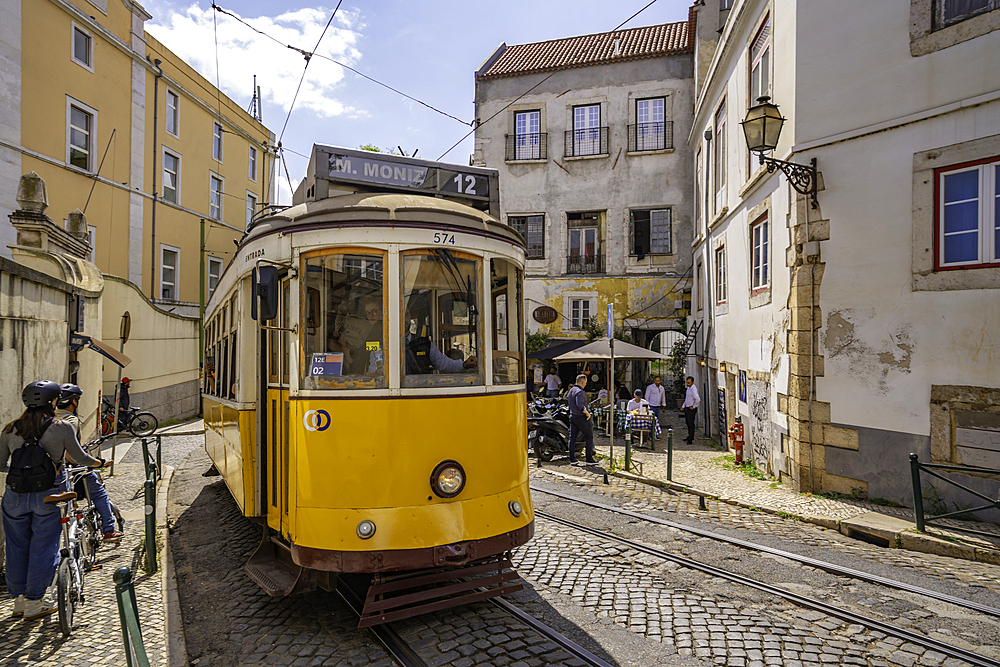 View of colourful architectecture and vintage tram in Alfama, Alfama District, Lisbon, Portugal, Europe