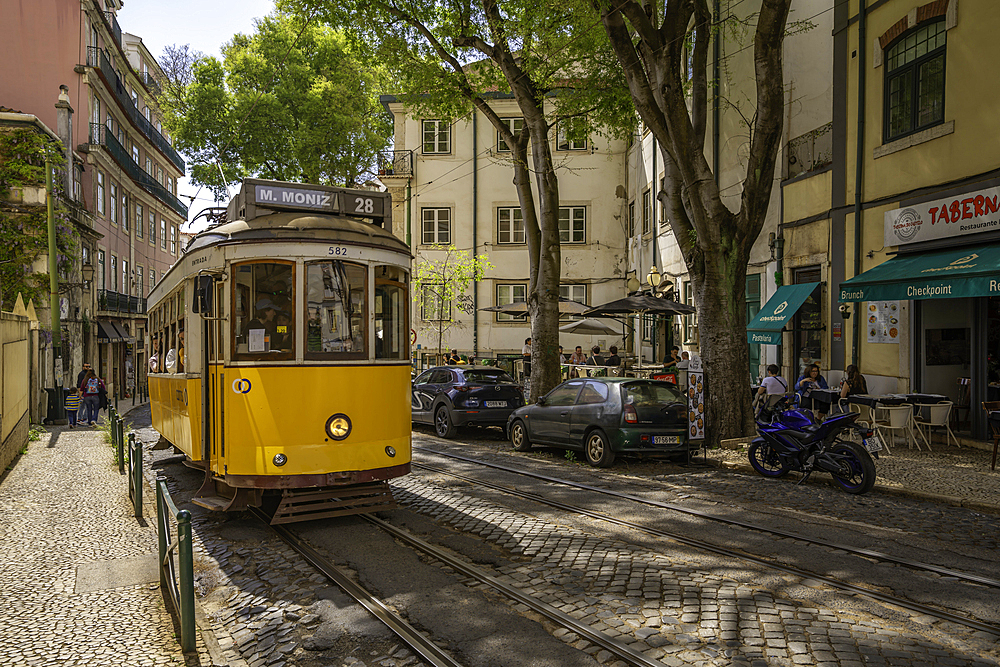 View of colourful architectecture and vintage tram in Alfama, Alfama District, Lisbon, Portugal, Europe