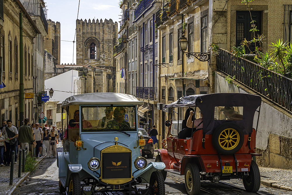 View of Tuk Tuks and Lisbon Cathedral in Alfama, Alfama District, Lisbon, Portugal, Europe