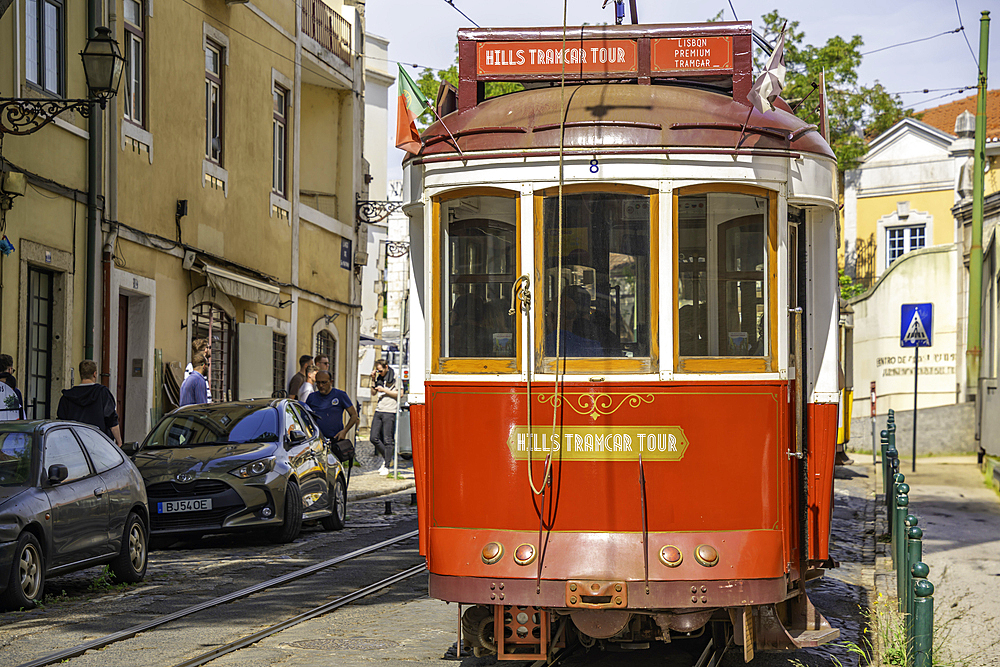 View of vintage tram narrow street in Alfama, Alfama District, Lisbon, Portugal, Europe