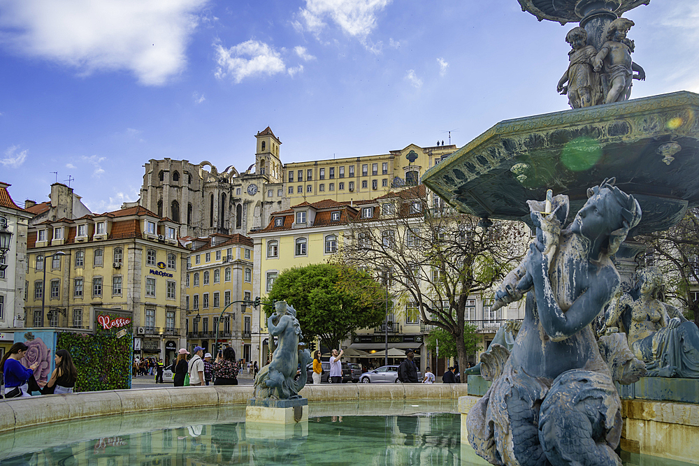 View of South Fountain in Praca do Rossio and Carmo Archaeological Museum, Lisbon, Portugal, Europe