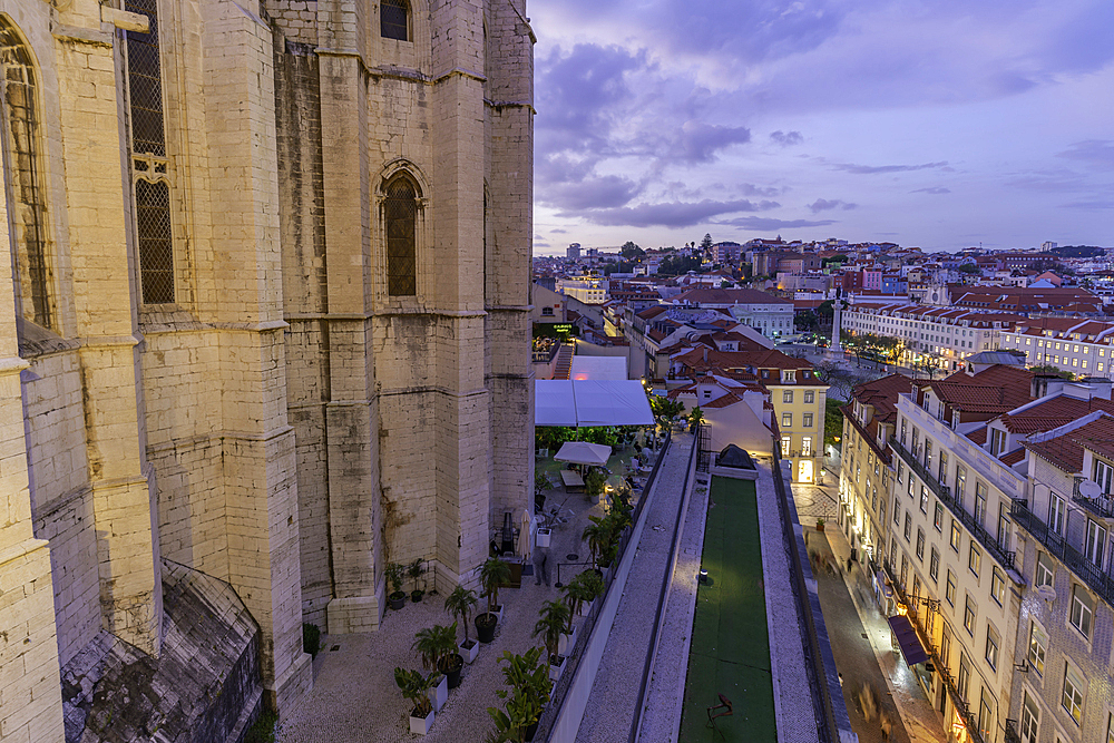 View of city rooftops and Carmo Archaeological Museum from Santa Justa Lift at sunset, Lisbon, Portugal, Europe