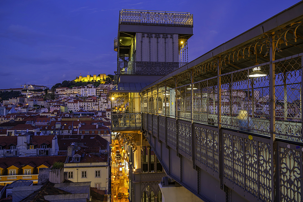 View of Lisbon Castle and Santa Justa Lift from Carmo Archaeological Museum during golden hour, Lisbon, Portugal, Europe